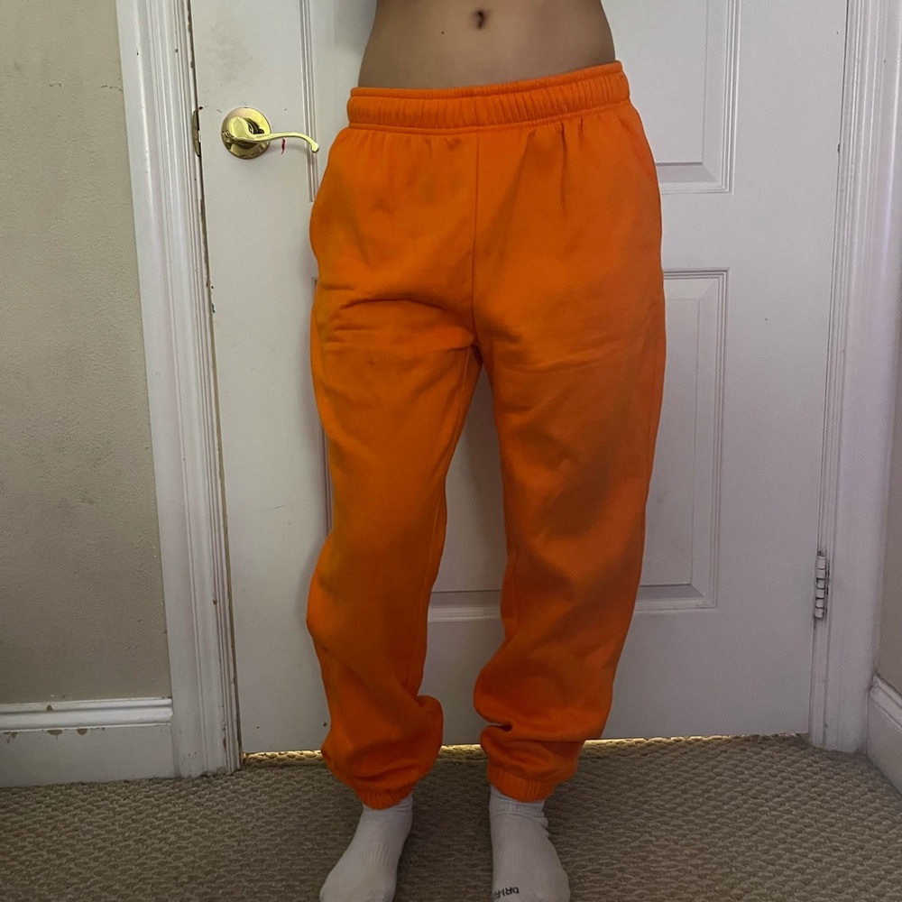 bright orange sweatpants